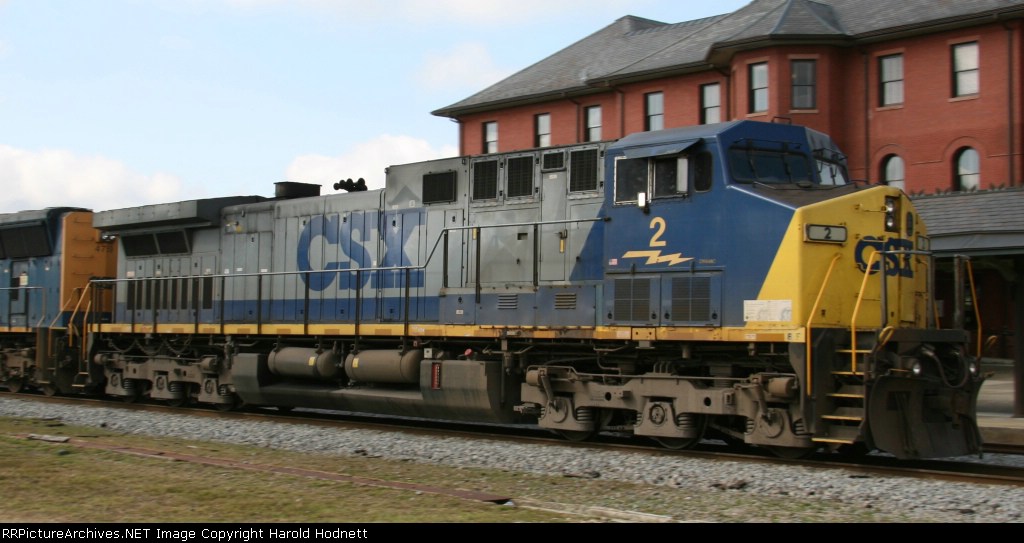 CSX 2 leads a train northbound past the station